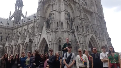 A group of students in front of a large historical building.