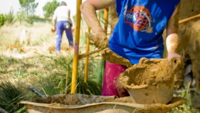 A student using a wheelbarrow.