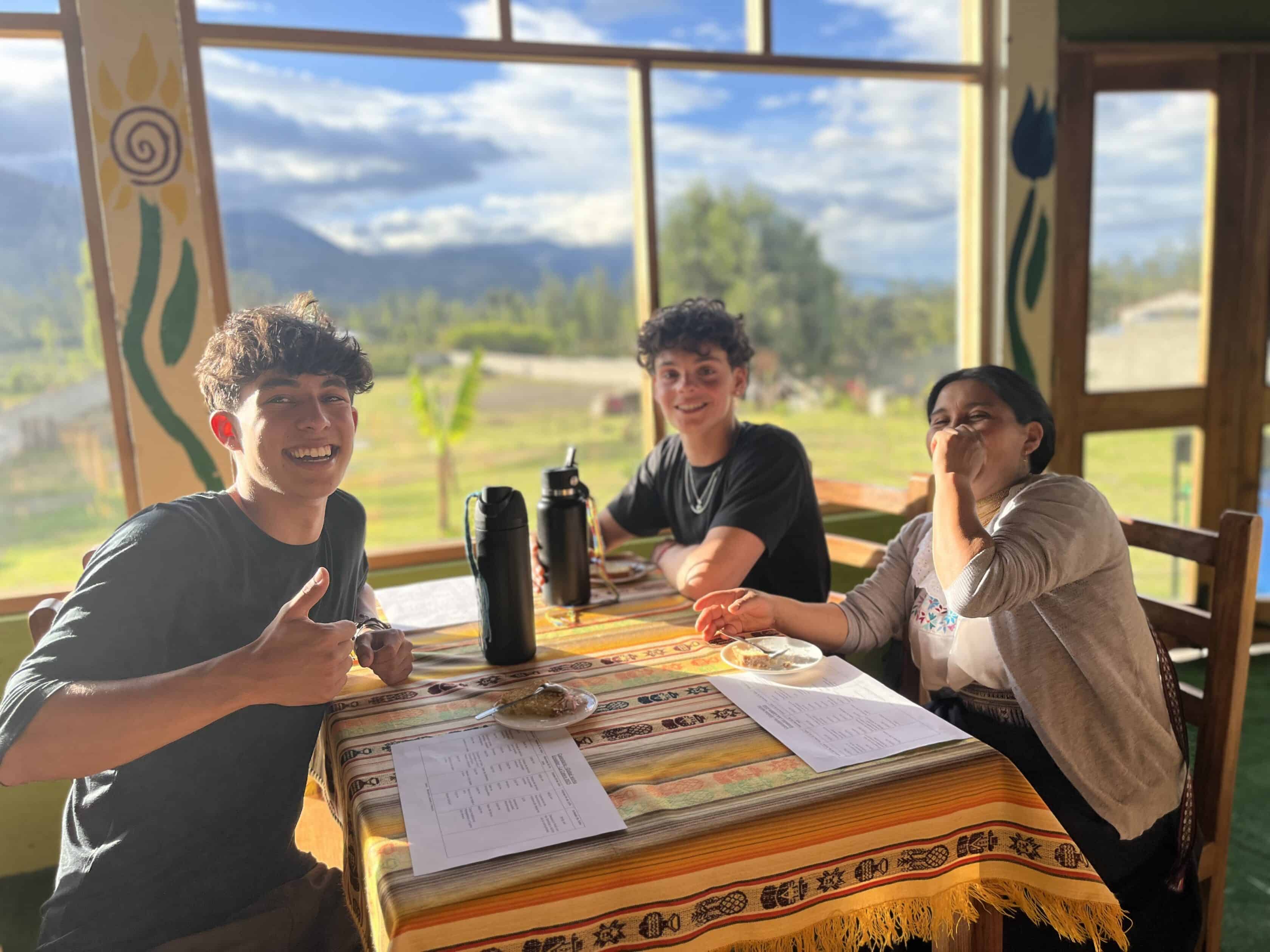 Two students engage with a local in Ecuador on a Spanish immersion program to enhance Spanish skills